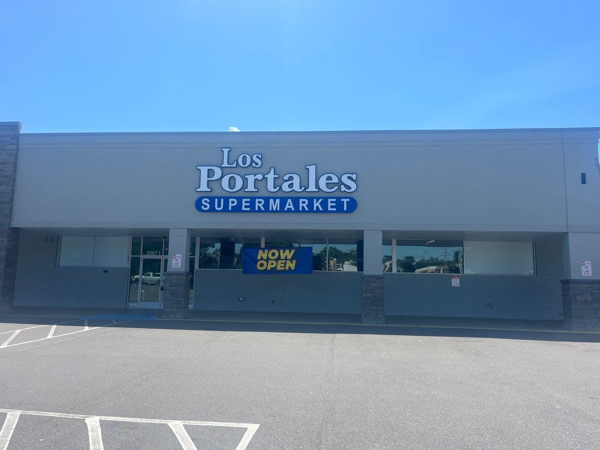 Los Portales Supermarket storefront exterior with "Now Open" banner — Wilmington, NC